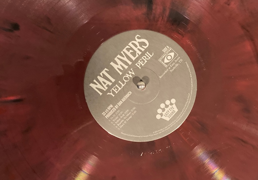 Center label of Nat Myers Yellow Peril maroon swirl vinyl edition. 